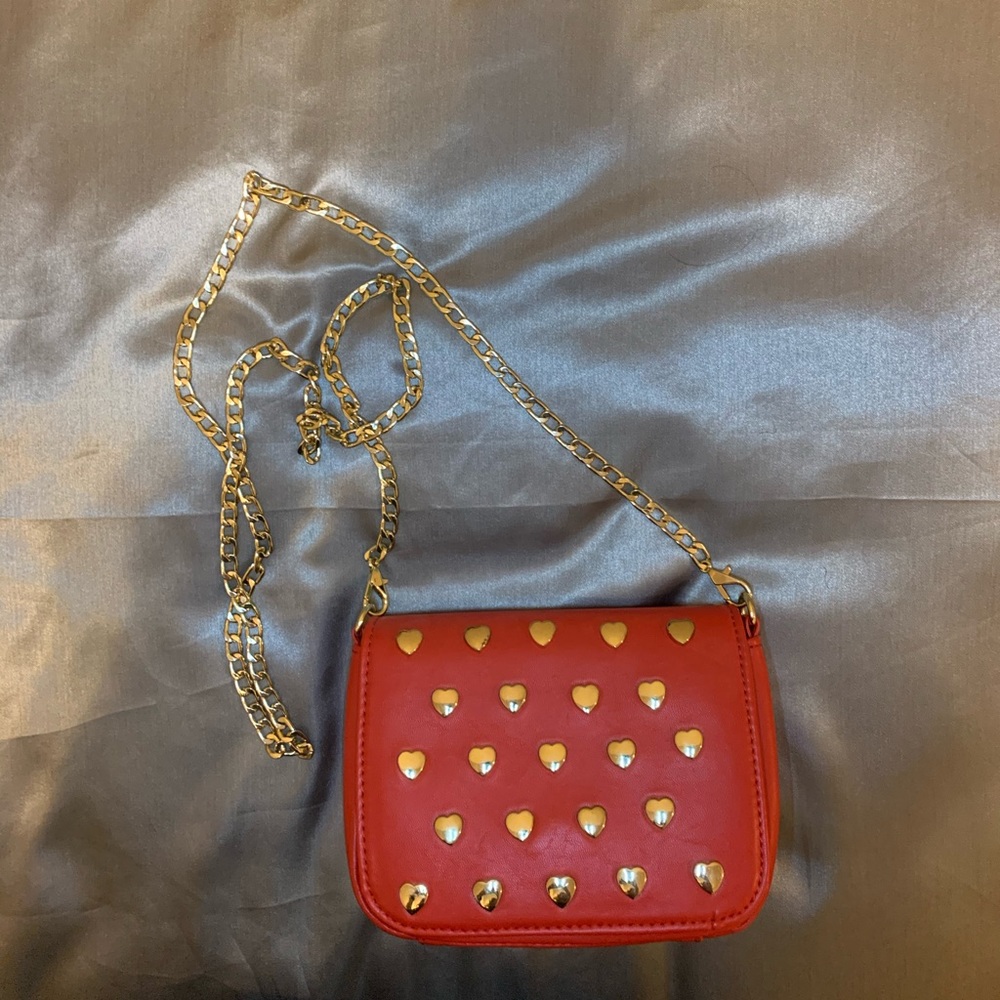 Brand new red purse with gold hearts. Never used!!